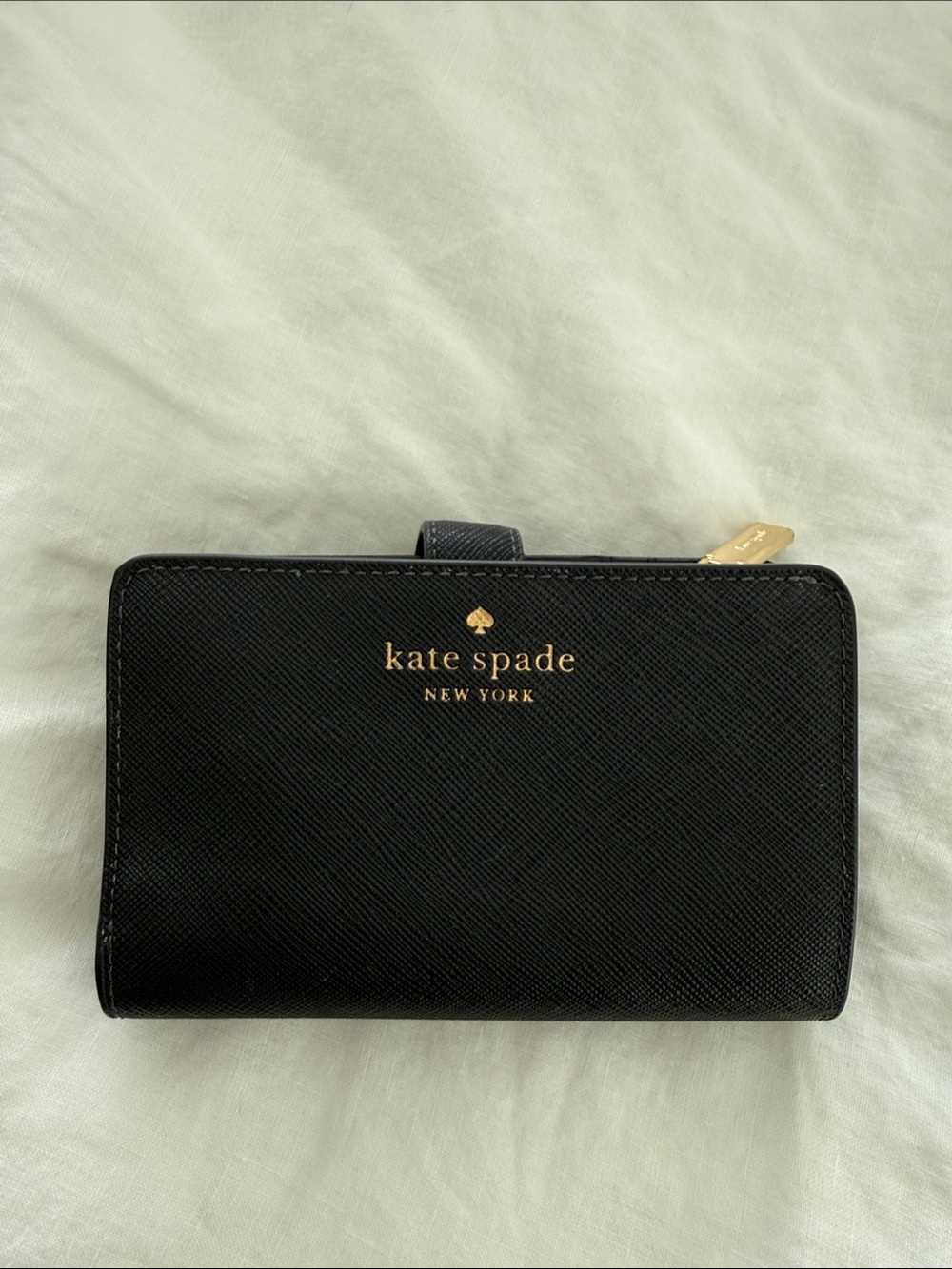 kate spade black leather compact zip-around wallet with gold logo